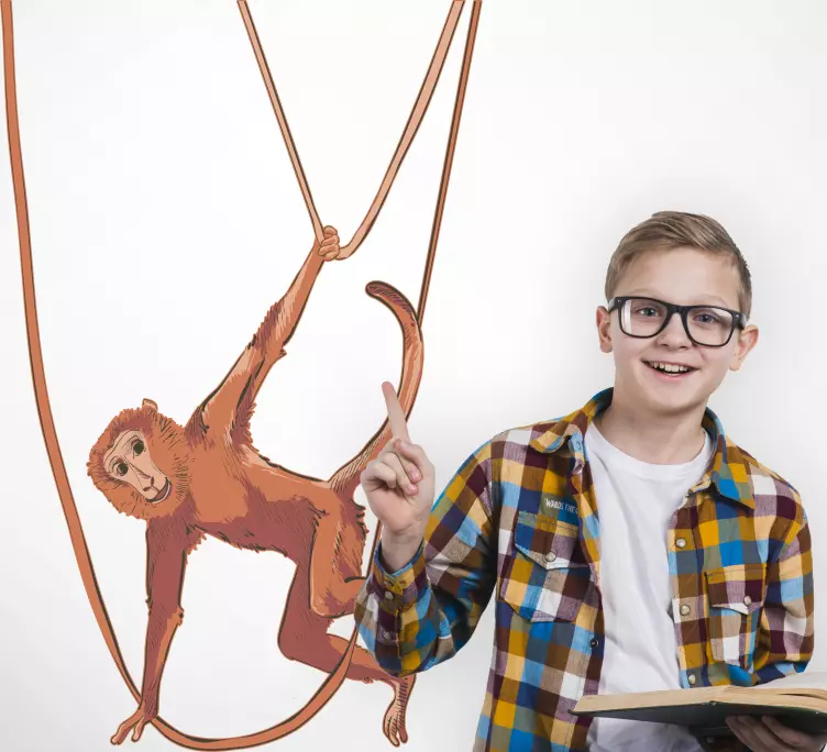 Baby monkey houpající se na obtisku rostlinného zvířete - TenStickers